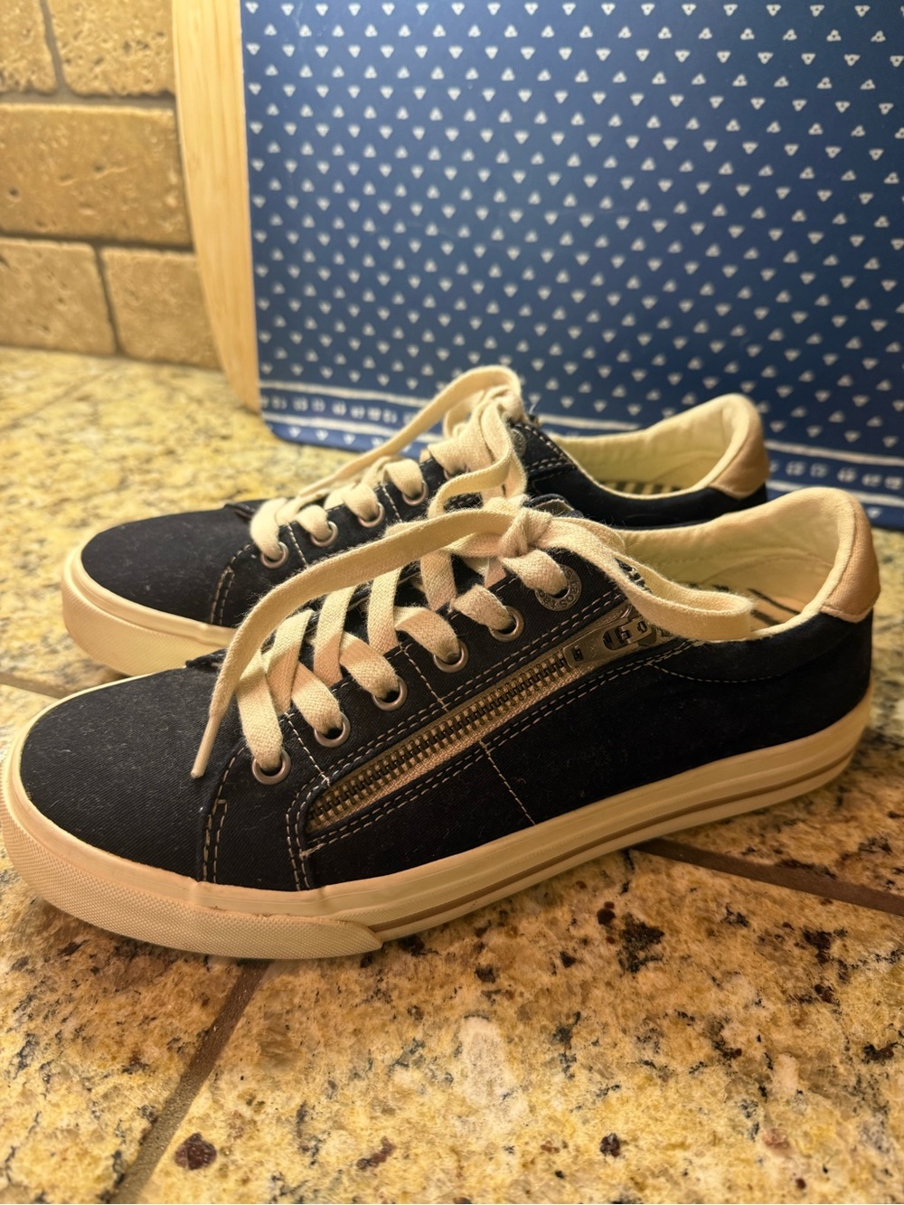 Taos Footwear Black and Cream Low-Top Sneakers with Side Zip Detail